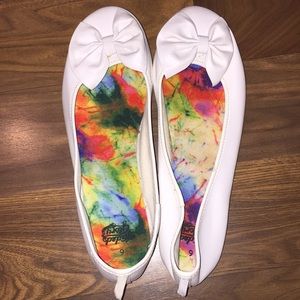 White shoes with a bow on it